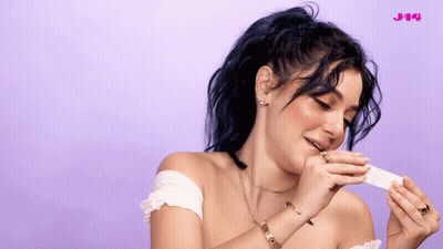 Woman Holding Paper Saying J14 GIF