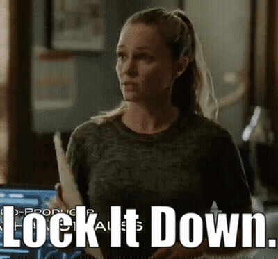 Woman Holding Paper Saying Lock It Down GIF