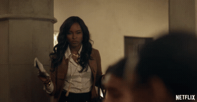 Woman Holding Paper With Netflix Logo GIF