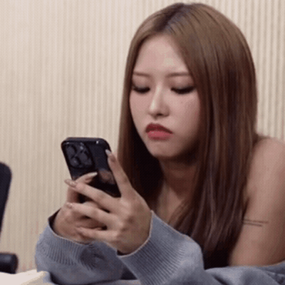 Woman Holding Phone Making Funny Face GIF
