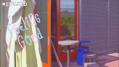Woman Holding Picture Frame In Mirror GIF