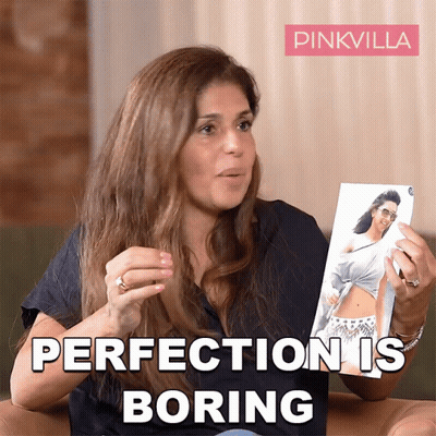 Woman Holding Picture Saying Perfection Is Boring GIF