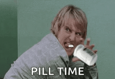 Woman Holding Pills Screaming GIF