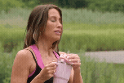 Woman Holding Pink Cup With Straw GIF