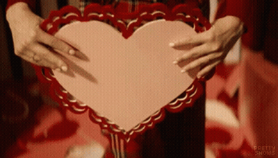 Woman Holding Pink Heart With Pretty Shows GIF