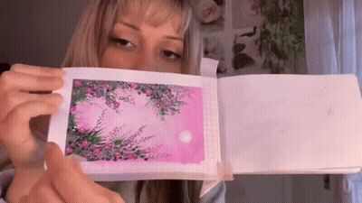 Woman Holding Pink Paper GIF