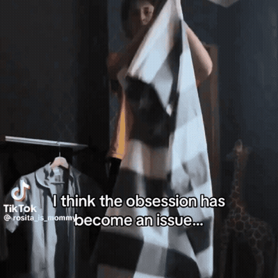 Woman Holding Plaid Blanket Saying Obsession Issue GIF