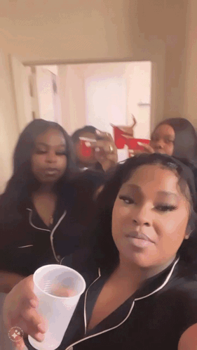 Woman Holding Plastic Cup To Face GIF
