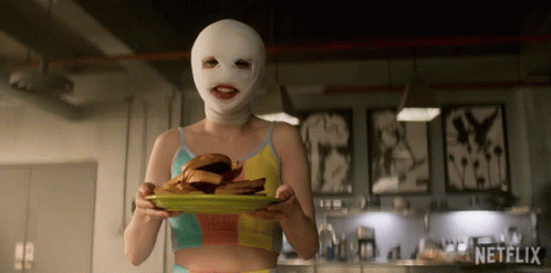 Woman Holding Plate Of Food With Netflix GIF