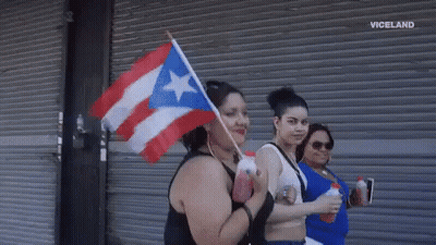 Woman Holding Puerto Rico Flag GIF