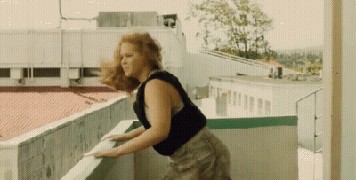 Woman Holding Railing On Balcony Hair Blowing GIF