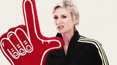 Woman Holding Red Foam Finger Saying Add GIF