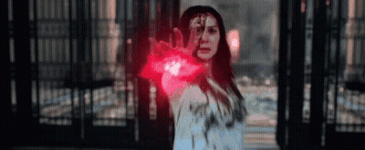 Woman Holding Red Glowing Object GIF
