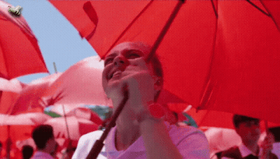 Woman Holding Red Umbrella With Bee GIF