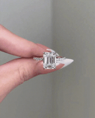 Woman Holding Ring With Large Diamond GIF