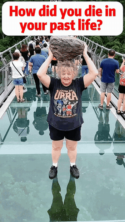 Woman Holding Rock Over Head In Ubra Shirt GIF