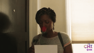 Woman Holding Rose and Paper Saying Chi
