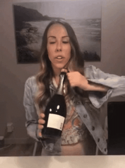 Woman Holding Ross Wine Bottle GIF