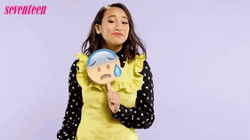 Woman Holding Sad Emoji Sensible Chuckle GIF