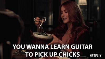 Woman Holding Scissors Says Wanna Learn Guitar To Pick Up Chickens Netflix Ad GIF