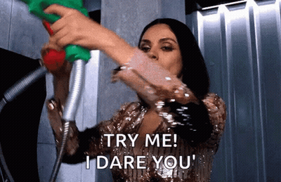 Woman Holding Shower Head Saying Try Me I Dare You GIF