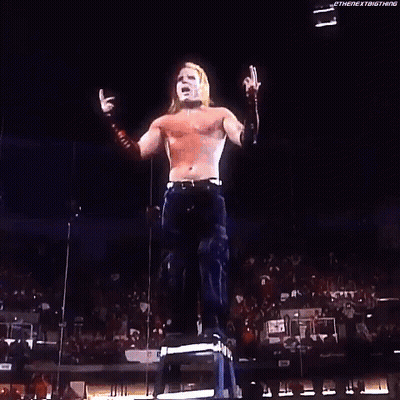 Woman Holding Sign Saying Wes On Stage GIF