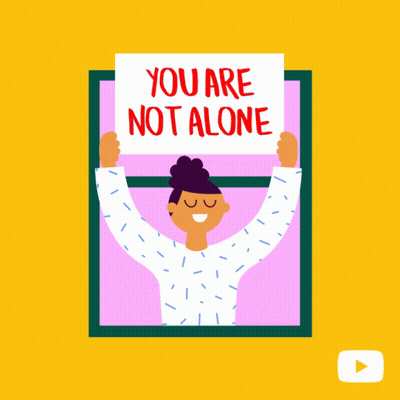 Woman Holding Sign Saying You Are Not Alone GIF