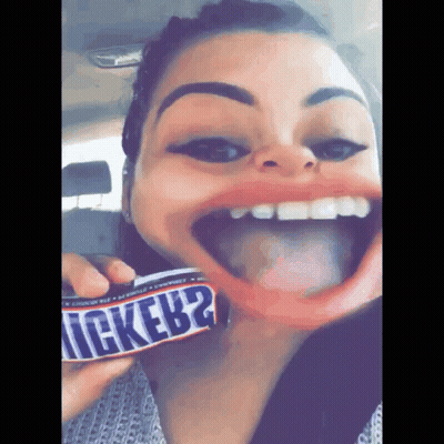 Woman Holding Snickers Bar GIF