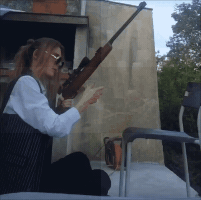 Woman Holding Sniper Rifle GIF