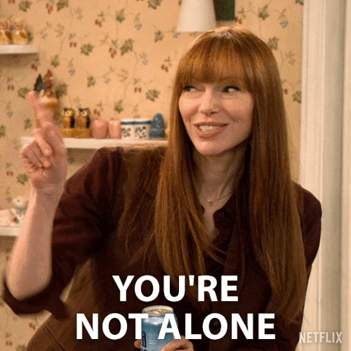 Woman Holding Soda Saying You Are Not Alone GIF