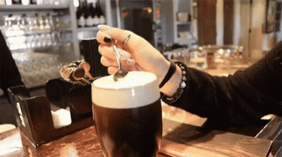 Woman Holding Spoon Over Coffee GIF