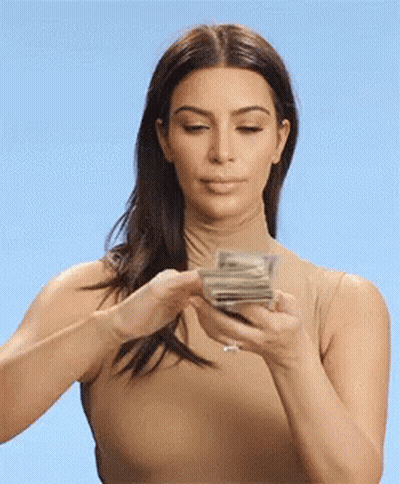 Woman Holding Stack of Money