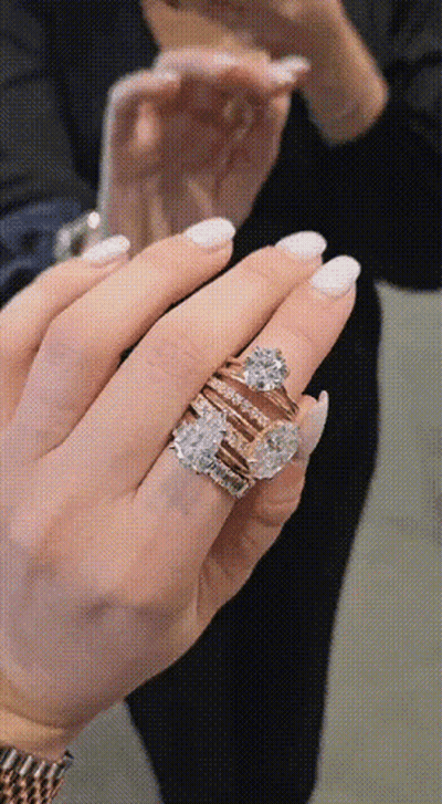 Woman Holding Stack Of Rings GIF
