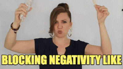 Woman Holding Stick Making Face Blocking Negativity GIF