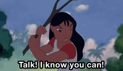 Woman Holding Stick Saying Talk I Know You Can GIF