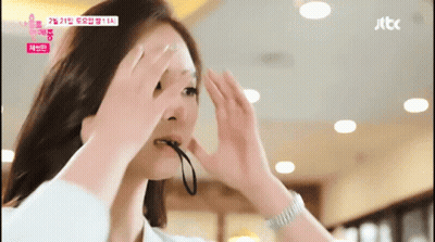 Woman Holding String In Mouth With JTBC Logo GIF