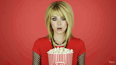 Woman Holding Striped Bucket Of Popcorn GIF