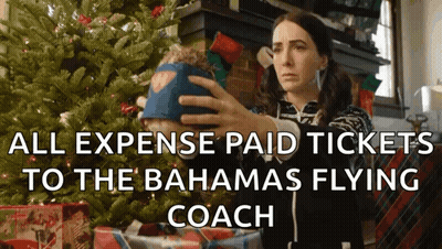 Woman Holding Stuffed Animal By Christmas Tree All Expense Paid Tickets To The Bahama GIF
