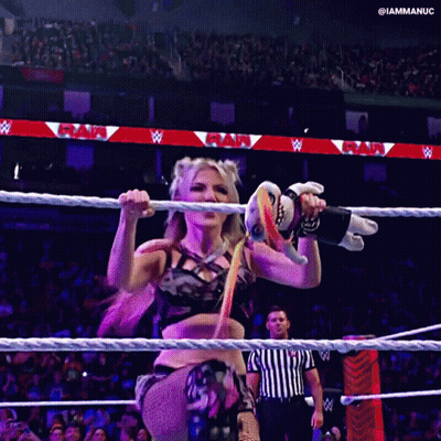 Woman Holding Stuffed Animal In Wrestling Ring With Referee GIF