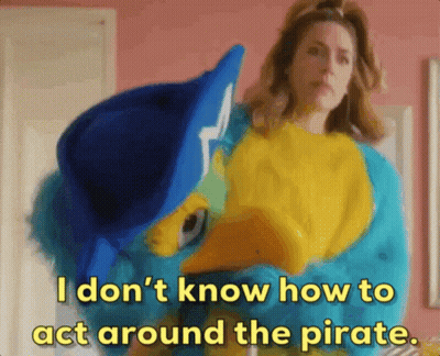 Woman Holding Stuffed Animal Saying I Don't Know How To Act Around The Pirate GIF