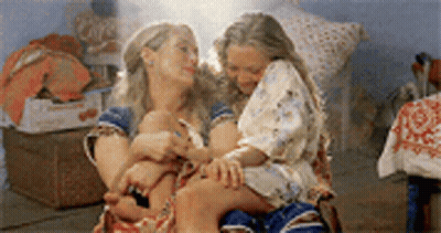 Woman Holding Sword At Gas Pump GIF