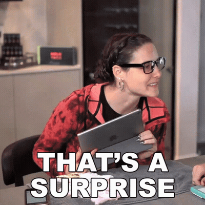 Woman Holding Tablet Smiling Saying That's A Surprise GIF