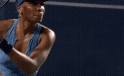 Woman Holding Tennis Racquet In Front Of National Bank Sign GIF