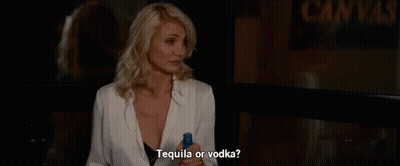 Woman Holding Tequila And Vodka GIF