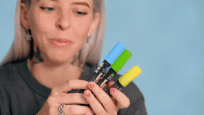 Woman Holding Three Different Colored Markers GIF