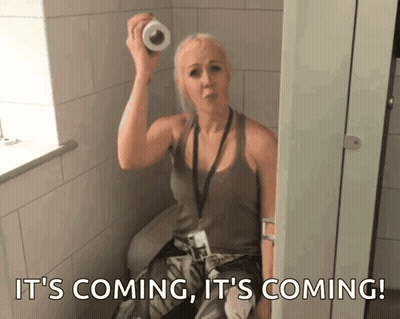 Woman Holding Toilet Paper Roll It's Coming GIF