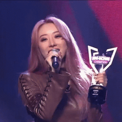 Woman Holding Trophy Singing GIF