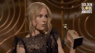Woman Holding Trophy Talking Into Microphone Golden Globes Awards GIF