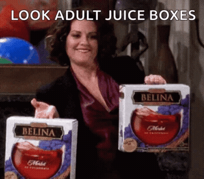 Woman Holding Two Boxes Of Belina Juice GIF