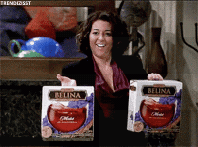 Woman Holding Two Boxes Of Belina Juice GIF